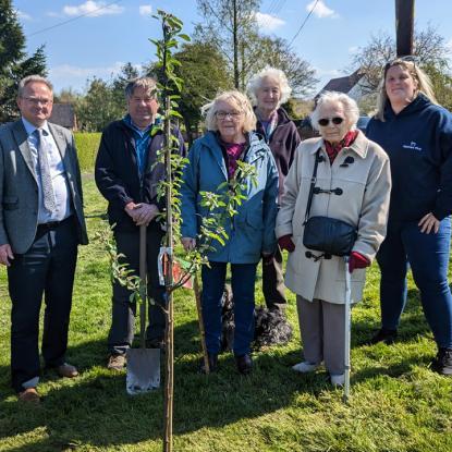 Homes Plus helps villagers with Coronation tree planting